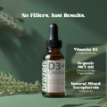 Brazen D3+ Charge supplement bottle with green leaves on a green background